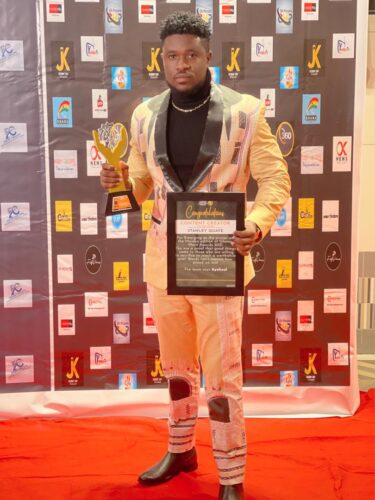 stanbelove with his award and certificate at the just ended Ghana Merit Awards 21 